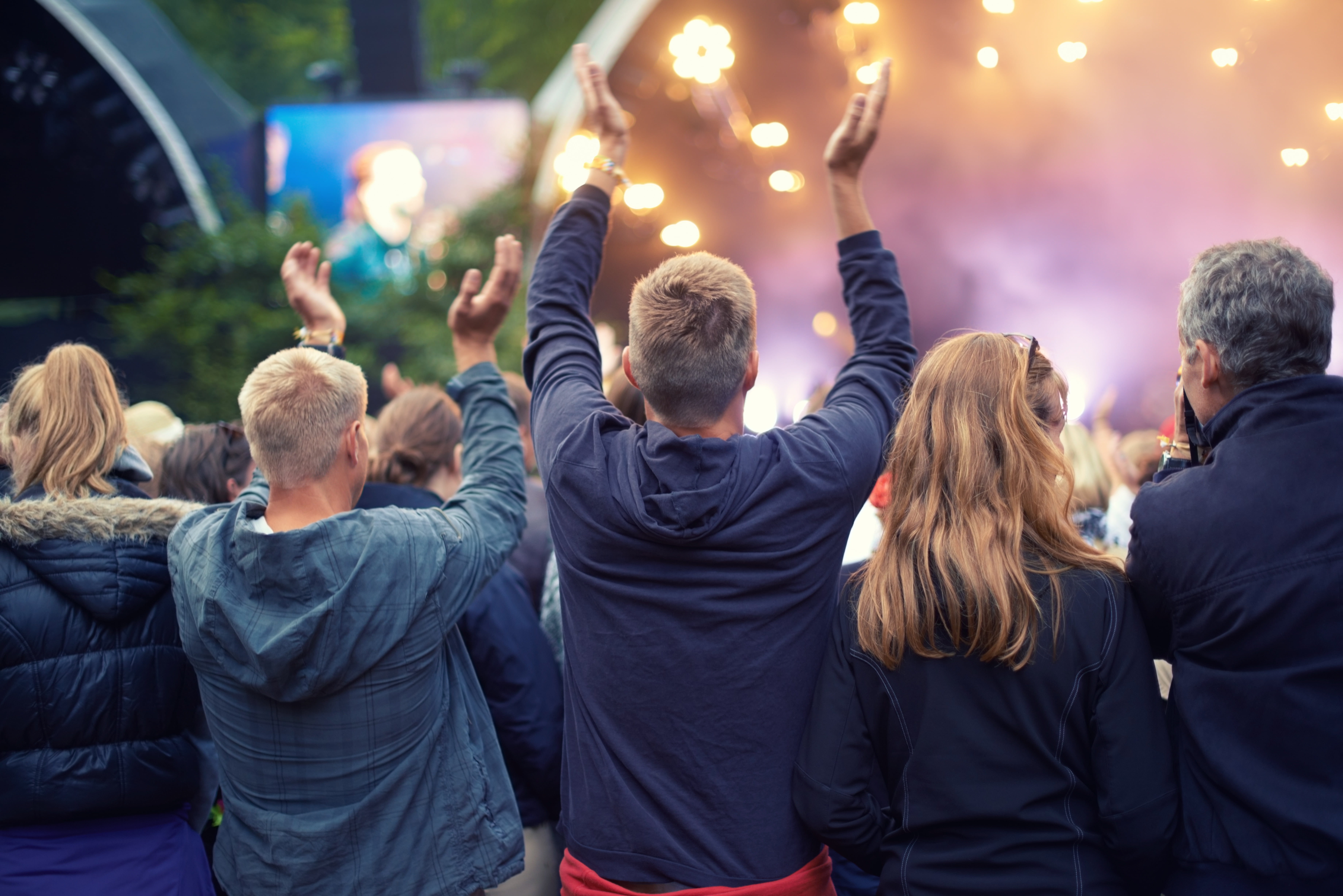 Adoring audience. A crowd dancing at an outdoor music event.