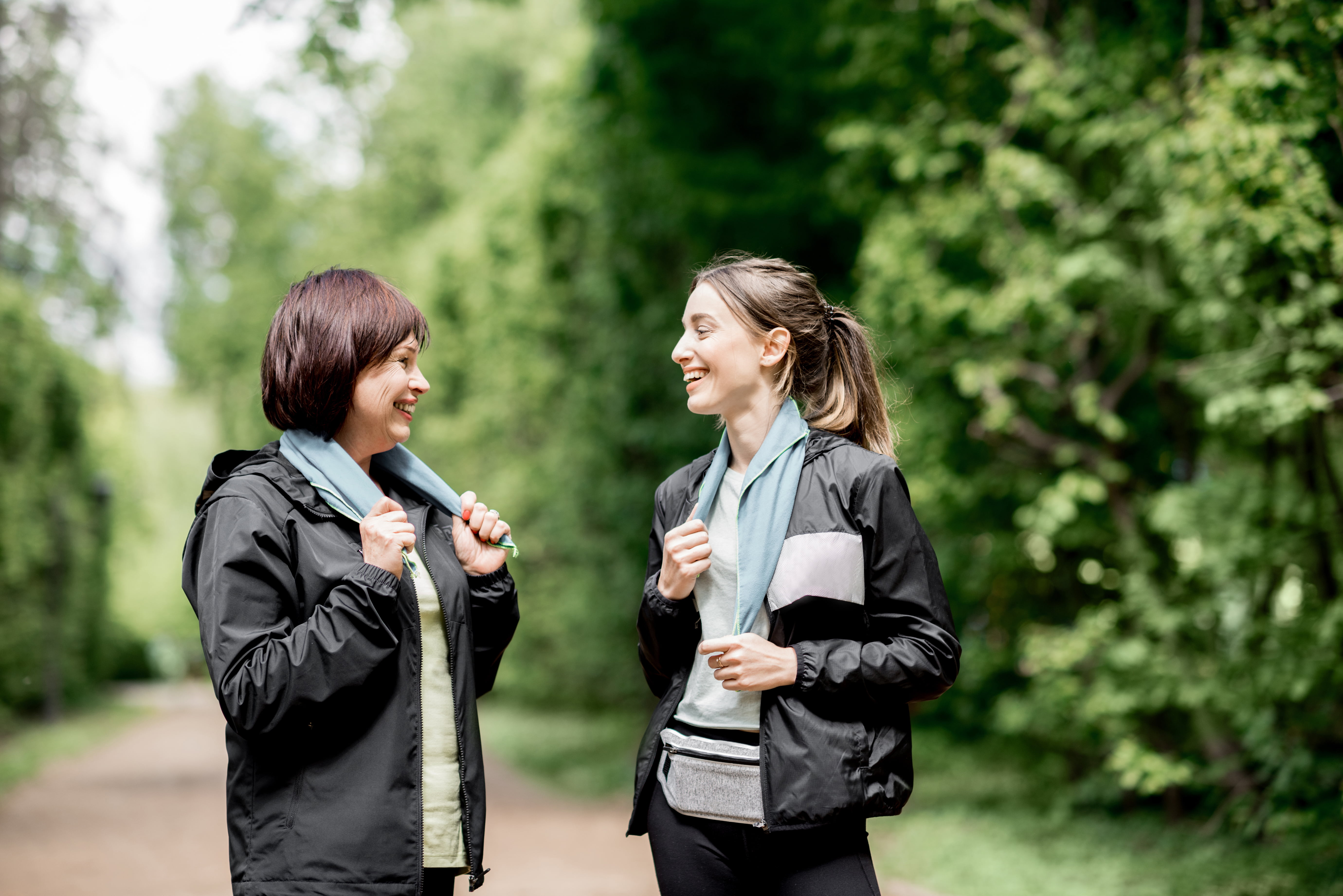 Two sports women talking in the park